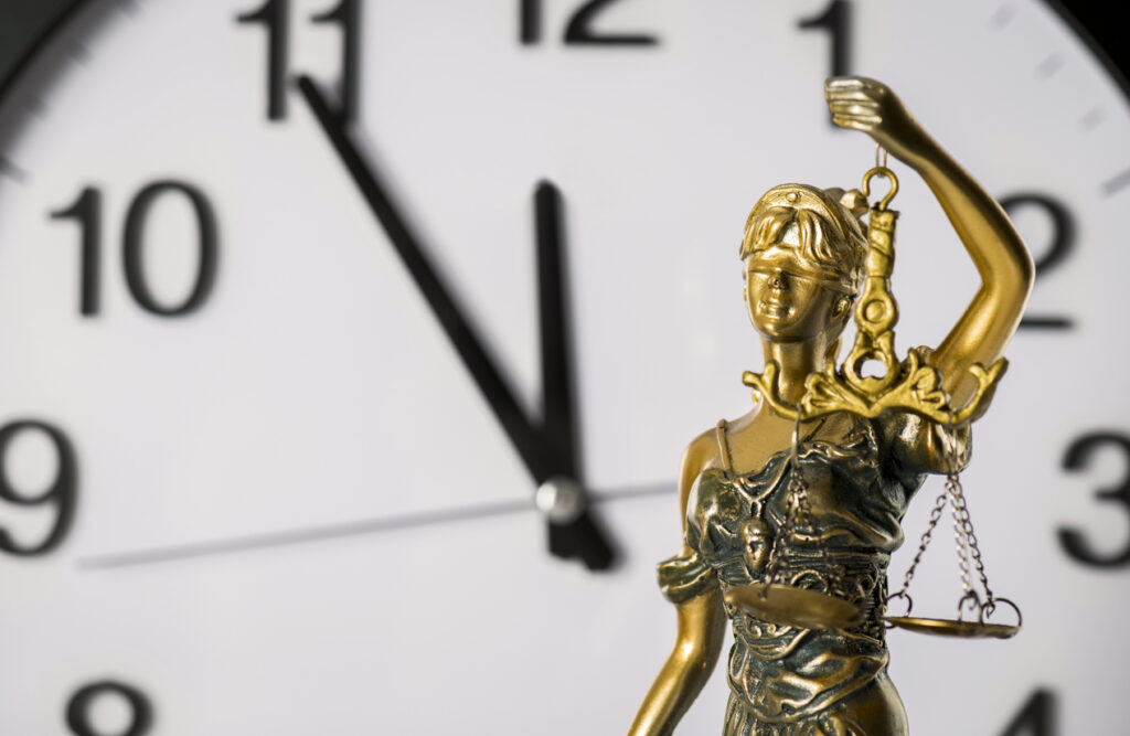 Clock and lady justice statue