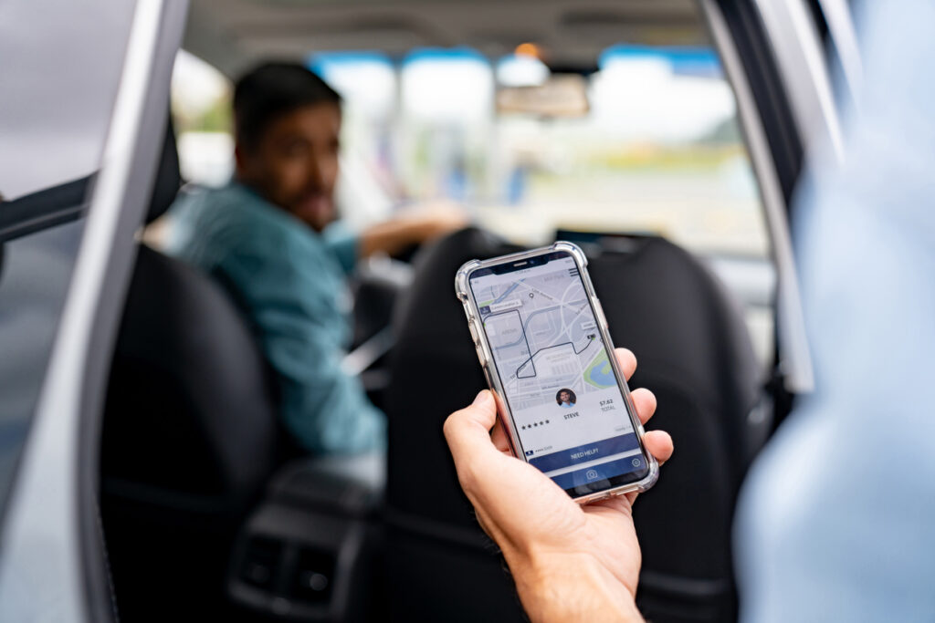 Man getting into a car he requested using a mobile app